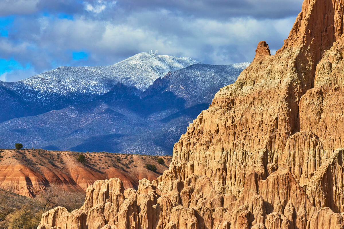 Formations Against Snowy Mountains