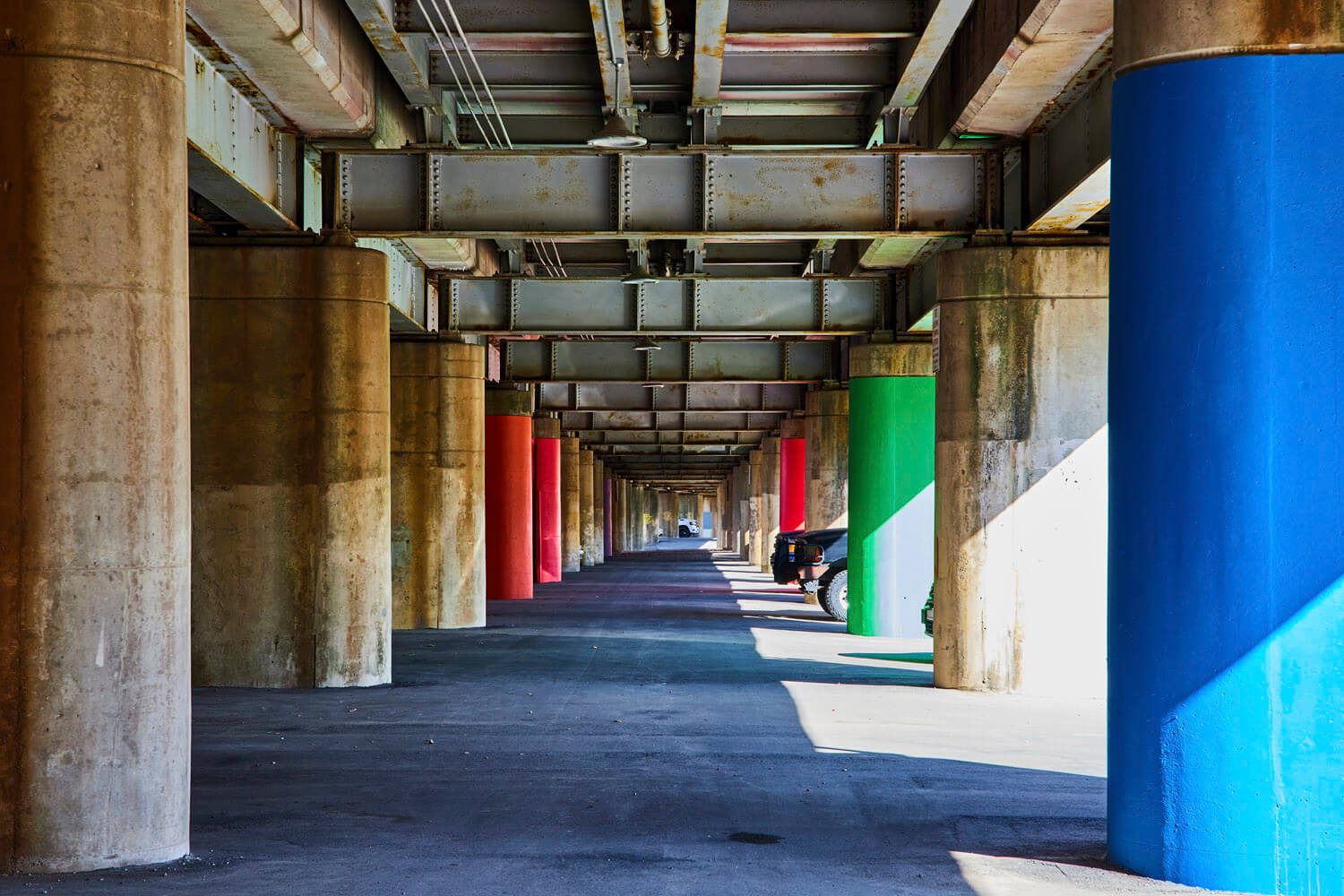 Parking under Train Tracks with Colored Columns